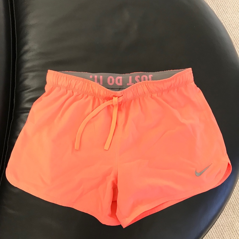 Nike women’s running shorts in coral color
